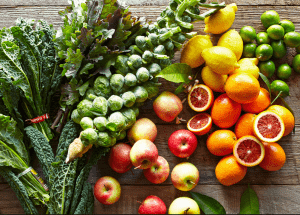 a group of fruits and vegetables on a wood surface Healthy Weight Loss Diets Cribbs Causeway